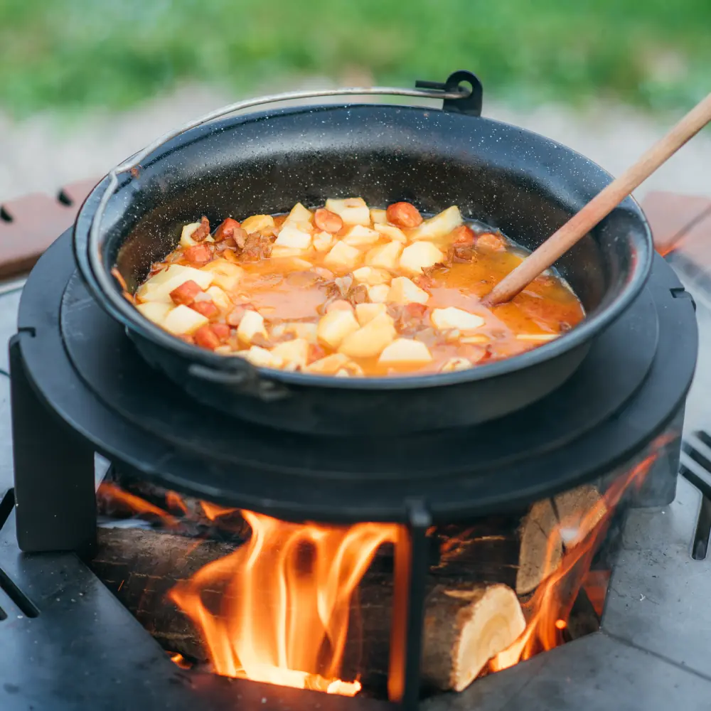 Traditional Hungarian goulash is cooking in the kettle