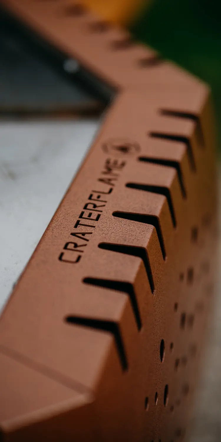 Showcasing the CRATERFLAME® logo laser cut on the grill's shell